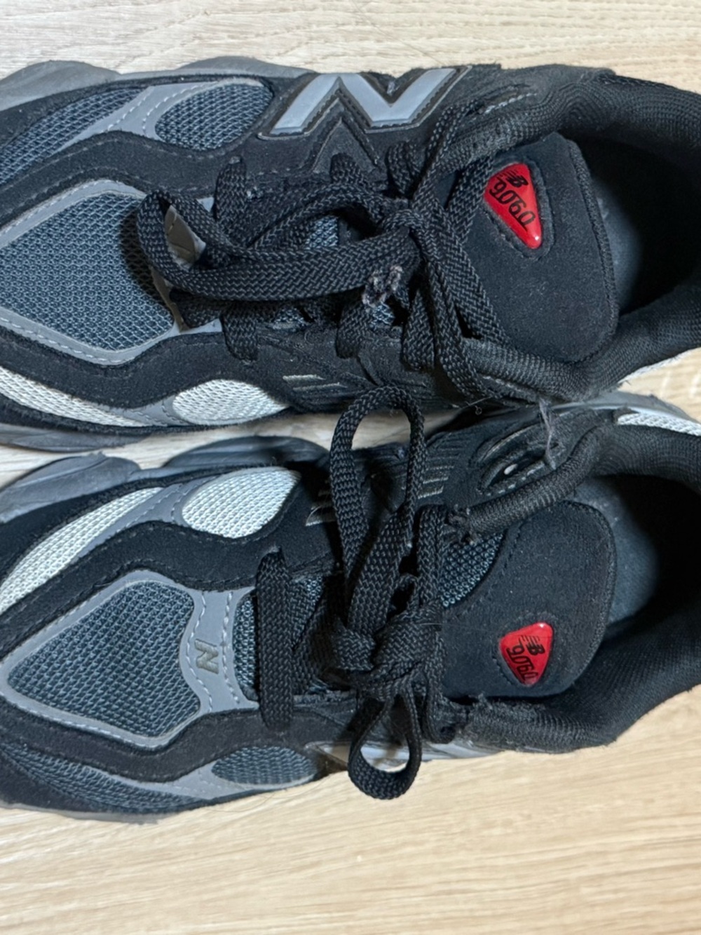 New Balance Black and Gray Men's Athletic Sneakers with Red Logo Accents